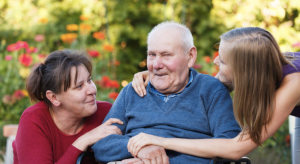 Resident with dementia receiving gentle support from a care worker in a calm and homely environment