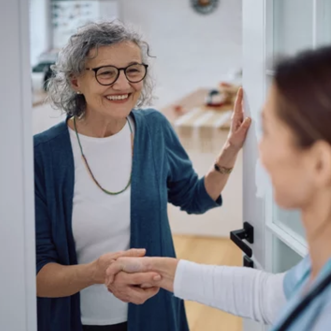 Dedicated caregiver providing one-to-one support for an elderly resident at Aurem Care